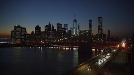 Naklejka premium Night view of the Brooklyn Bridge and Manhattan skyline.