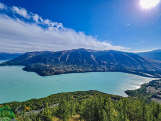 Obraz premium kanasi lake landscape or mountain view, scenery of mountain in China, travel destination or tour tourism, xinjiang, majestic panorama nature view. destination, blue sky, hill top, calmness.