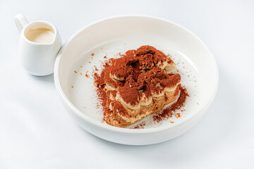 tiramisu cake with sauce on plate