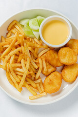 french fries with nuggets and sauce