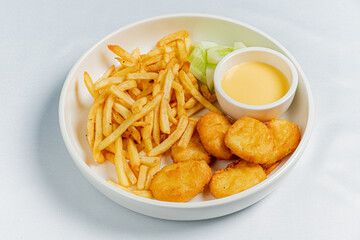 french fries with nuggets and sauce
