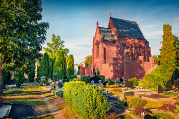 Spectacular morning view of red bricks Counts Tyshkevych Cahpel. Romantic summer cityscape of Kretinga town,  Lithuania, Europe. Traveling concept background.