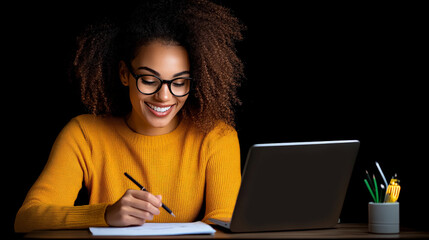 Night Owl's Focus: A young, smiling Black woman with afro hair, wearing glasses and a mustard yellow sweater, diligently works on a notepad using a pencil.