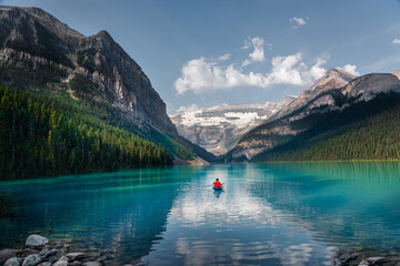 lake in the mountains on a summer day. Green lake for canoeing
