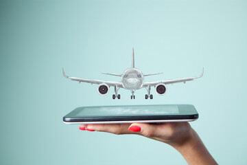 hand holding smartphone with plane
