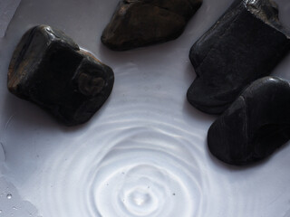 Stones in the water represent calm meditation.