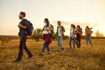 Group of people together hiking in nature, enjoying an adventure and excursion. This team is on a...