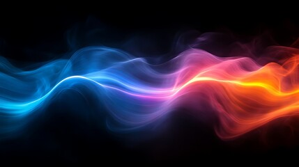 Obraz premium Colorful waves of light in a dark background.