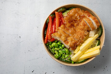 Asian fried chicken with vegetables in bowl
