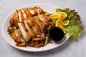 Asian fried chicken with vegetables and coconut sauce