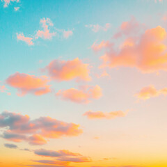 A soft pastel sky at sunset with hues of orange and pink blending into the blue sky above. The sky is adorned with delicate clouds that create an enchanting backdrop for various applications. 