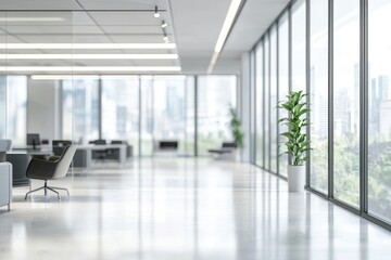 A modern office space featuring large windows, minimalist furniture, and indoor plants, promoting a productive work environment.
