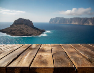 A serene coastal view of an island with calm waters from a wooden table in the foreground during daytime