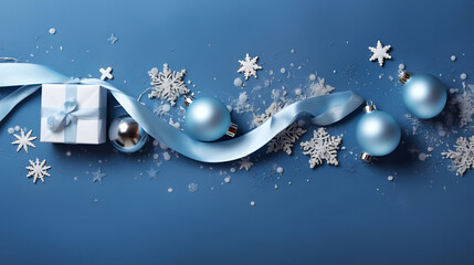 Naklejka premium Christmas gifts, balls, decorations and snowflakes in a row on a blue surface. Horizontal composition, flat lay, top view.