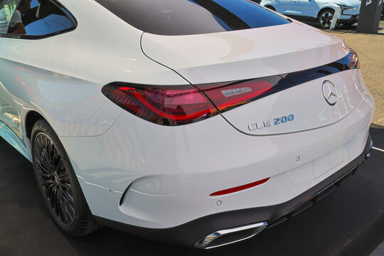 Detail of a white mercedes benz cle 200 coupe parked at a dealership