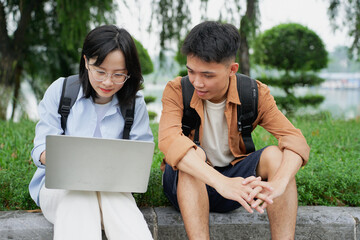 Two young Asian classmate playing at park after school
