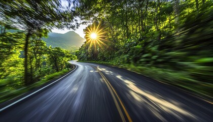 Obraz premium A winding road through lush greenery with sunlight peeking through the trees, creating a serene and inviting atmosphere.