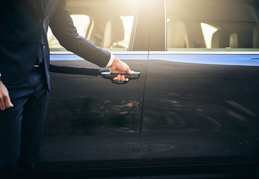 Hands, chauffeur and car with door handle, commute and style for pride in formal clothes. Male person, transport and fashion in business as professional driver for client, corporate and luxury travel