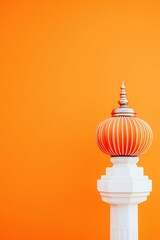 Vibrant Decorative Spire Against Bright Orange Background