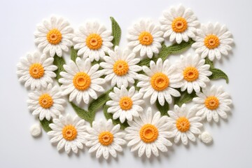 Fototapeta premium A vibrant arrangement of white daisies with yellow centers, complemented by green leaves, showcasing natural beauty and floral design.