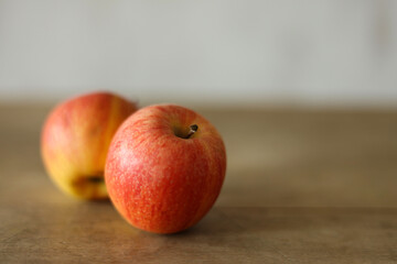 Ripe apples on a wooden table, shallow depth of field.