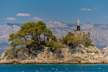 The port of Trpanja and the statue of Our Lady Star of the Sea