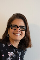 a latina lady smiling at the camera