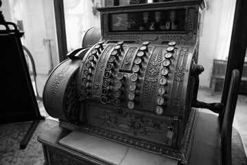 Old mechanical cash register in an old pharmacy