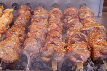 Kebabs on skewers are grilled on hot coals