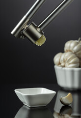 Garlic bulbs and garlic press.