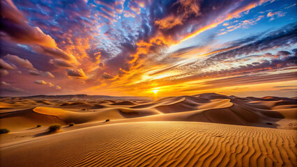Naklejka premium sunset over the desert. sand, desert, sky, landscape, dune, nature, sunset, beach, dry, sahara, sun, summer, travel, cloud, dunes, yellow, sea, hot, clouds, sunrise, day, heat, sunlight, orange, horiz