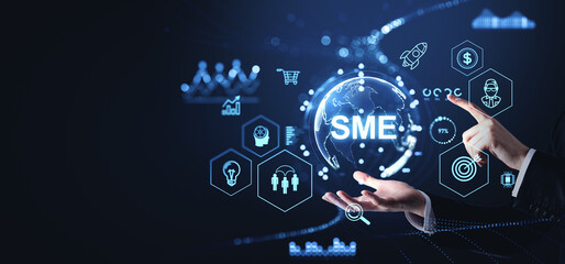 Man hands and finger touch SME glowing hologram with business management icons