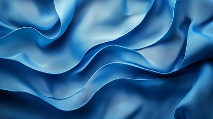 Obraz premium Close-up of flowing blue silk fabric with soft folds and elegant texture