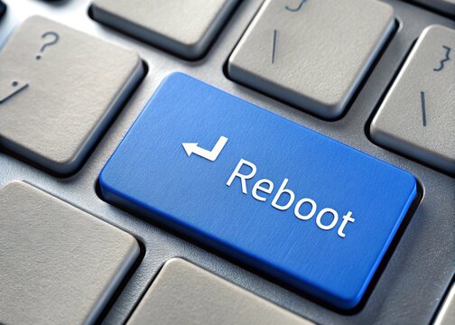 keyboard Reboot button, representing the concept of restarting, refreshing, and rebooting systems in technology and personal processes.
