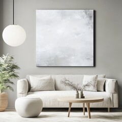 A neutral-themed living room with a white couch, minimalist decor, and a large abstract painting exudes calm and elegance.