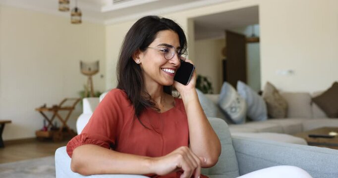 Woman engaging in work-related or personal pleasant conversation on the phone, lead talk to with family or friends, discuss weekend plans or events, receiving or sharing good news, dealing with matter