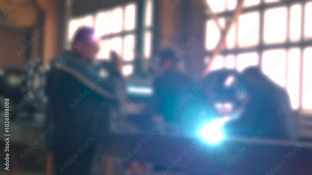 Poster in a vibrant workshop, skilled workers engage in welding tasks, showcasing teamwork and dedication. 