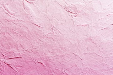 Fototapeta premium Close-up of wrinkled pink paper with a subtle gradient effect. 