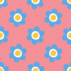 Seamless pattern with blue daisy flowers on pastel pink background. Cute childish style. Minimalist background for textile, fabrics, baby clothes, wallpapers