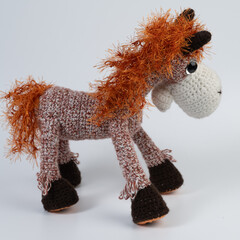 Amigurumi doll horse background white isolated