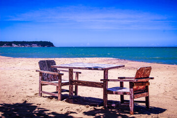Fototapeta premium table and chairs on the beach