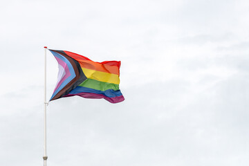 A vibrant display of the rainbow flag, symbolizing LGBTQ+ pride, diversity, and inclusion. The flag...
