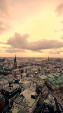 nostalgic static aerial panorama view of downtown Hamburg with town hall, st. nikolai's church, harbor, elbe river and st. michaelis church, 2023