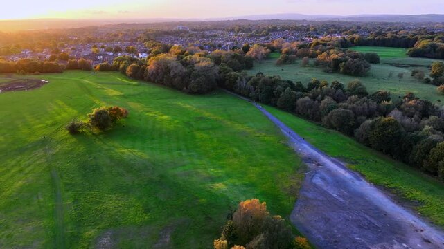 Aerial video of a sunset at Heaton Park, Prestwich - Greater Manchester. 
