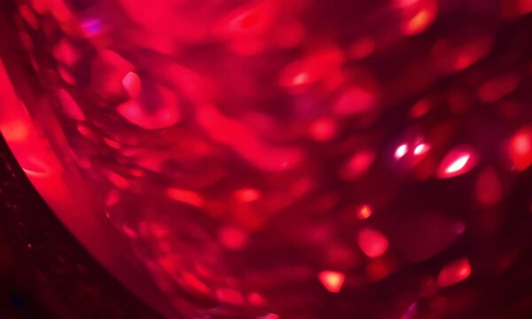 Crimson Abstract: A mesmerizing swirl of ruby red and crimson hues, creating a vibrant, abstract image perfect for design projects. The blurred bokeh effect adds depth and intrigue. 