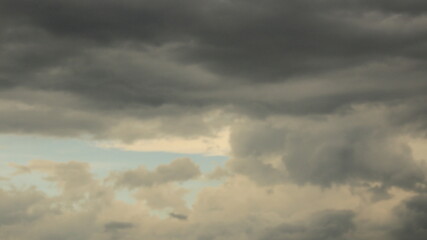 Fototapeta premium A breathtaking view of towering cumulus clouds Thunderous dark sky with black clouds 