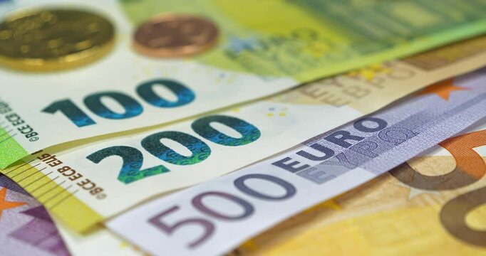 Banknotes 50, 100, 200 and 500 Euro and metal coins. Euro banknotes of various denominations. Real euro money of various colors and nominals and Euro cents. Cinema 4K 60fps video