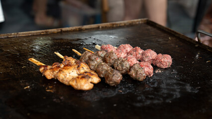 Grilled meat skewers in a herb marinade on a grill pan, top view, Fresh turkey meat skewers, Kabab, beef, street food