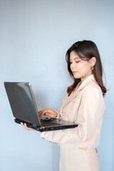 The Asian female executive is dedicated to empowering others, fostering a work culture where employees are encouraged to pursue their passions and contribute to the overall vision.