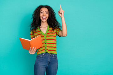 Photo portrait of pretty young girl read book eureka wear trendy striped outfit isolated on...